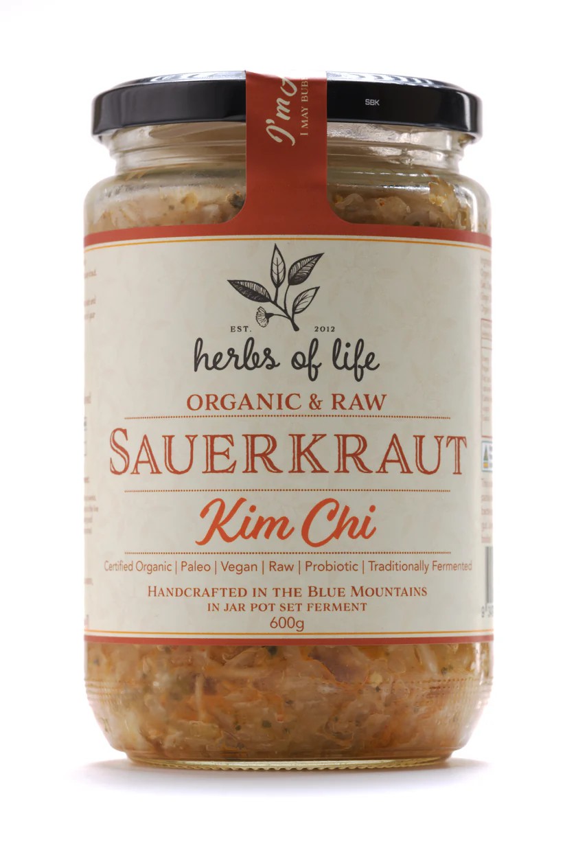 Jar of Herbs of Life Green Cabbage Kimchit on a white background<br />
