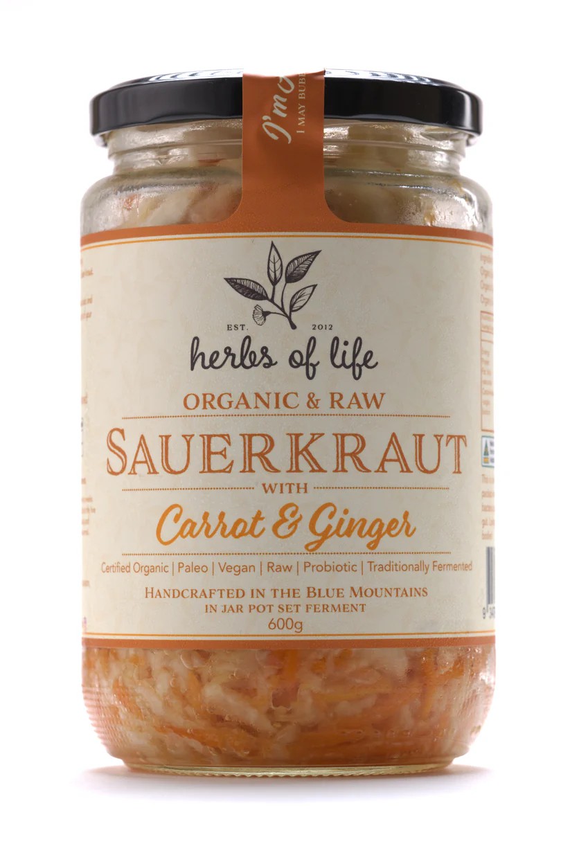Jar of Herbs of Life Green Cabbage Sauerkraut with Carrot and Gingeron a white background</p>
<p>