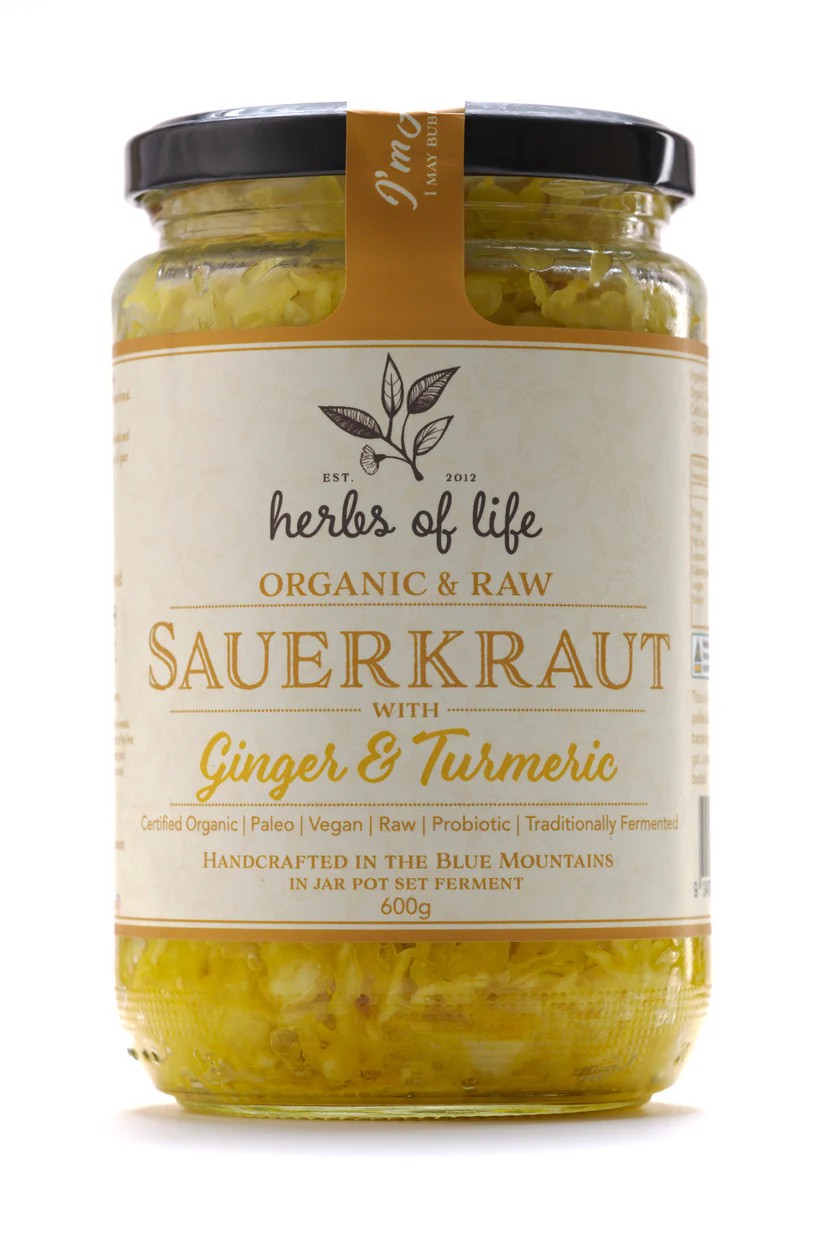 Jar of Herbs of Life Green Cabbage Sauerkraut with Ginger and Turmeric on a white background